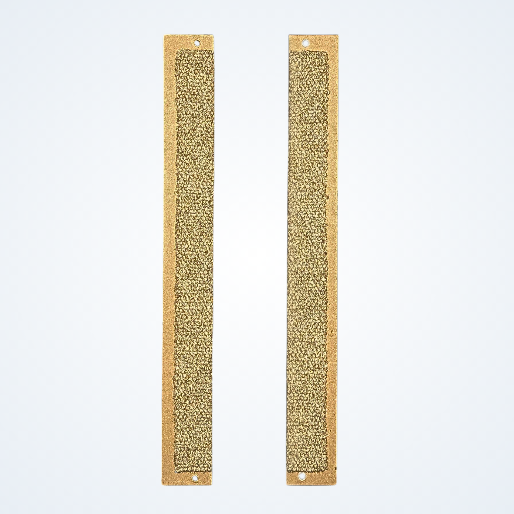 Two Jack's Scratcher carpet inserts on a light blue background. 